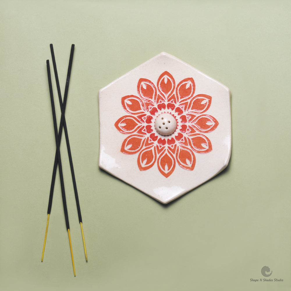 Handmade Ceramic Incense Stick Holder – Hexagonal, White Base with Orange Mandala Pattern